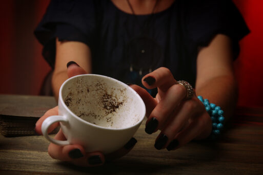 Witch - fortune teller reading fortune close up
гадание на кофейной гуще