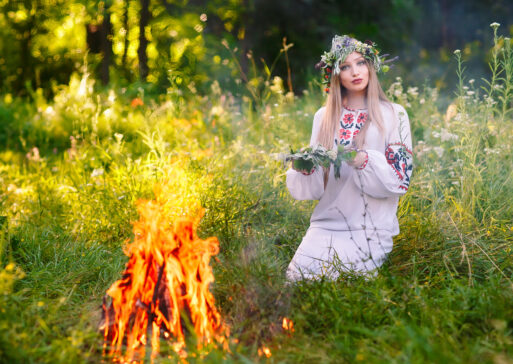 Midsummer. Woman weaving a wreath near the fire.
Иван Купала
